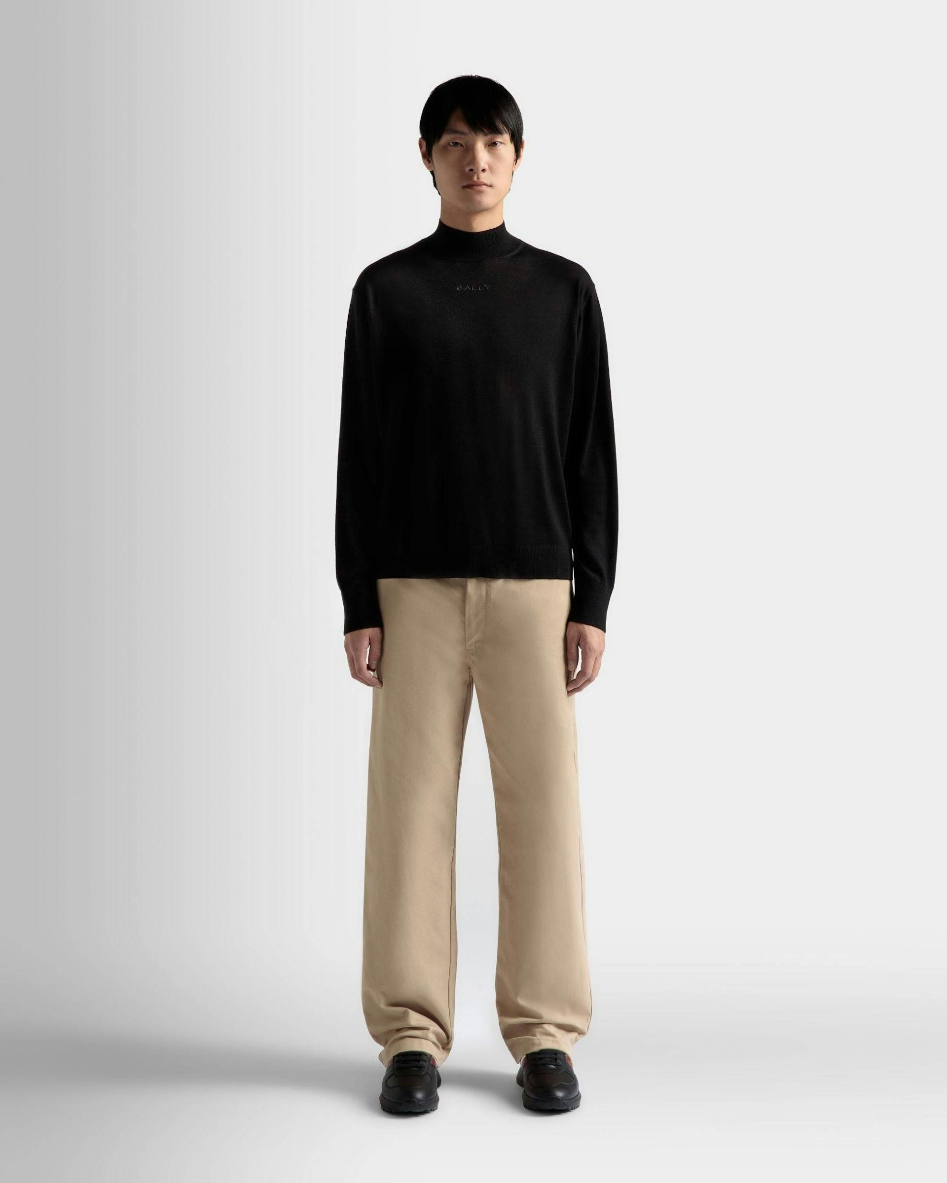 Men's Roll Neck Sweater in Black Wool | Bally | On Model Front