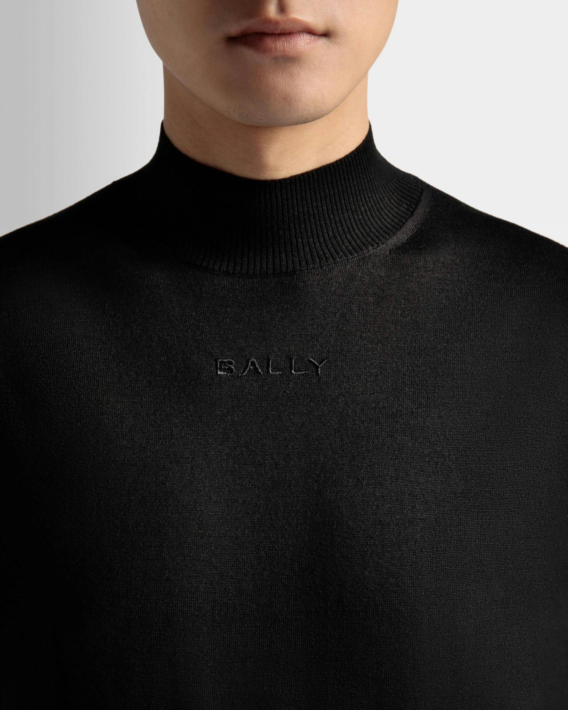 Men's Roll Neck Sweater in Black Wool | Bally | On Model Detail