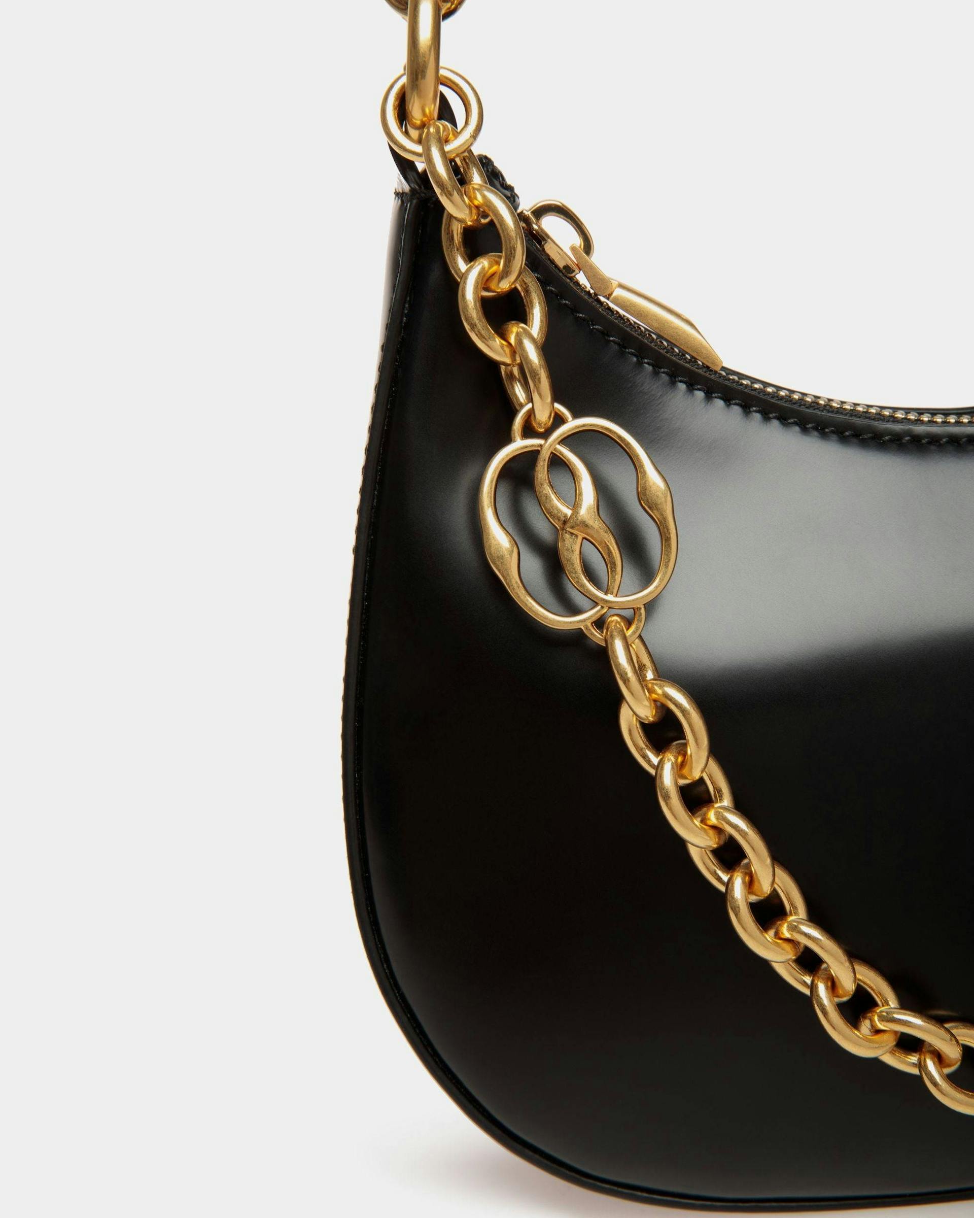 Women's Emblem Mini Crossbody Bag in Black Patent Leather | Bally | Still Life Detail
