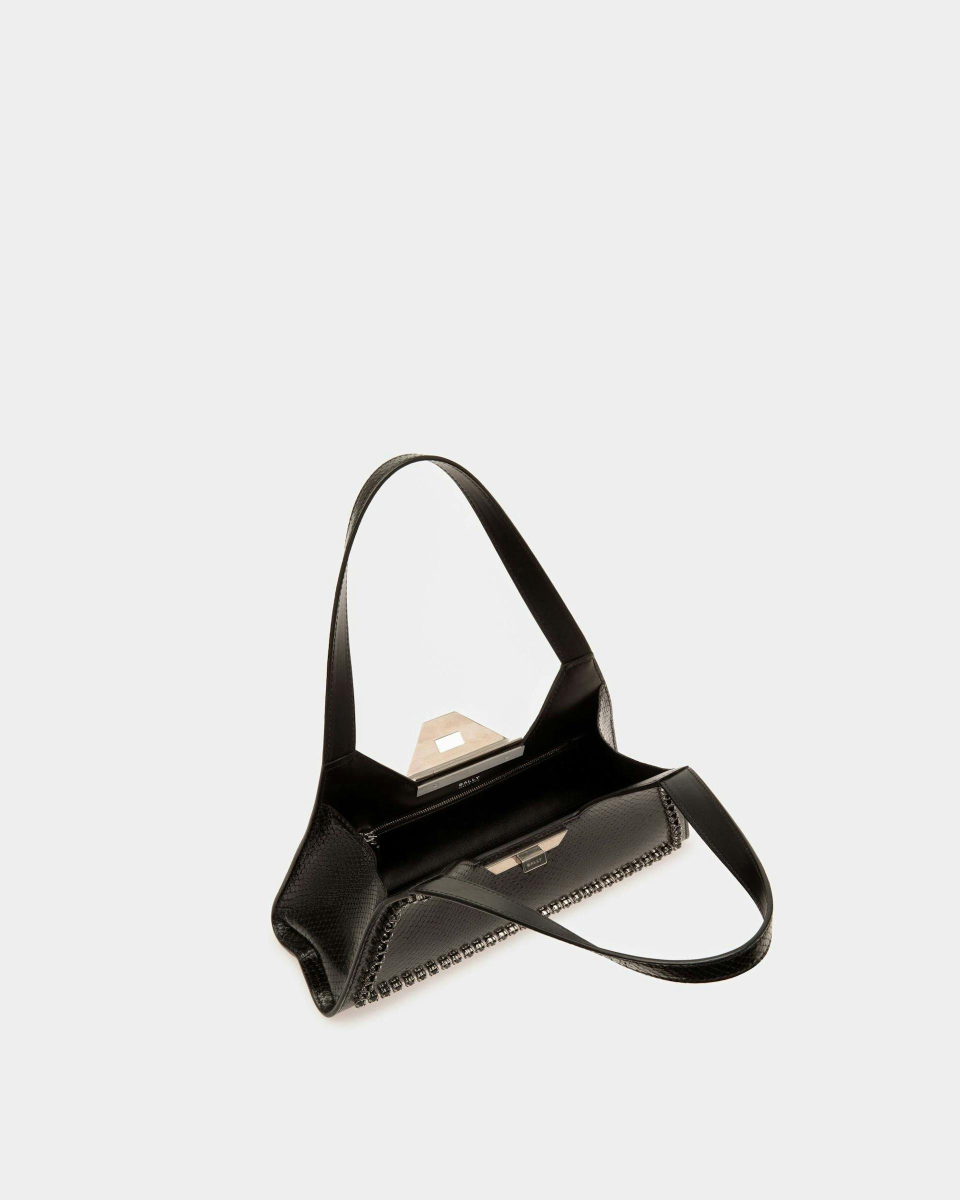 Women's Tilt Small Shoulder Bag in Black Python Printed Leather | Bally | Still Life Open / Inside