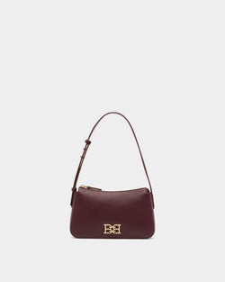 Petit sac porté épaule en cuir grainé bordeaux foncé